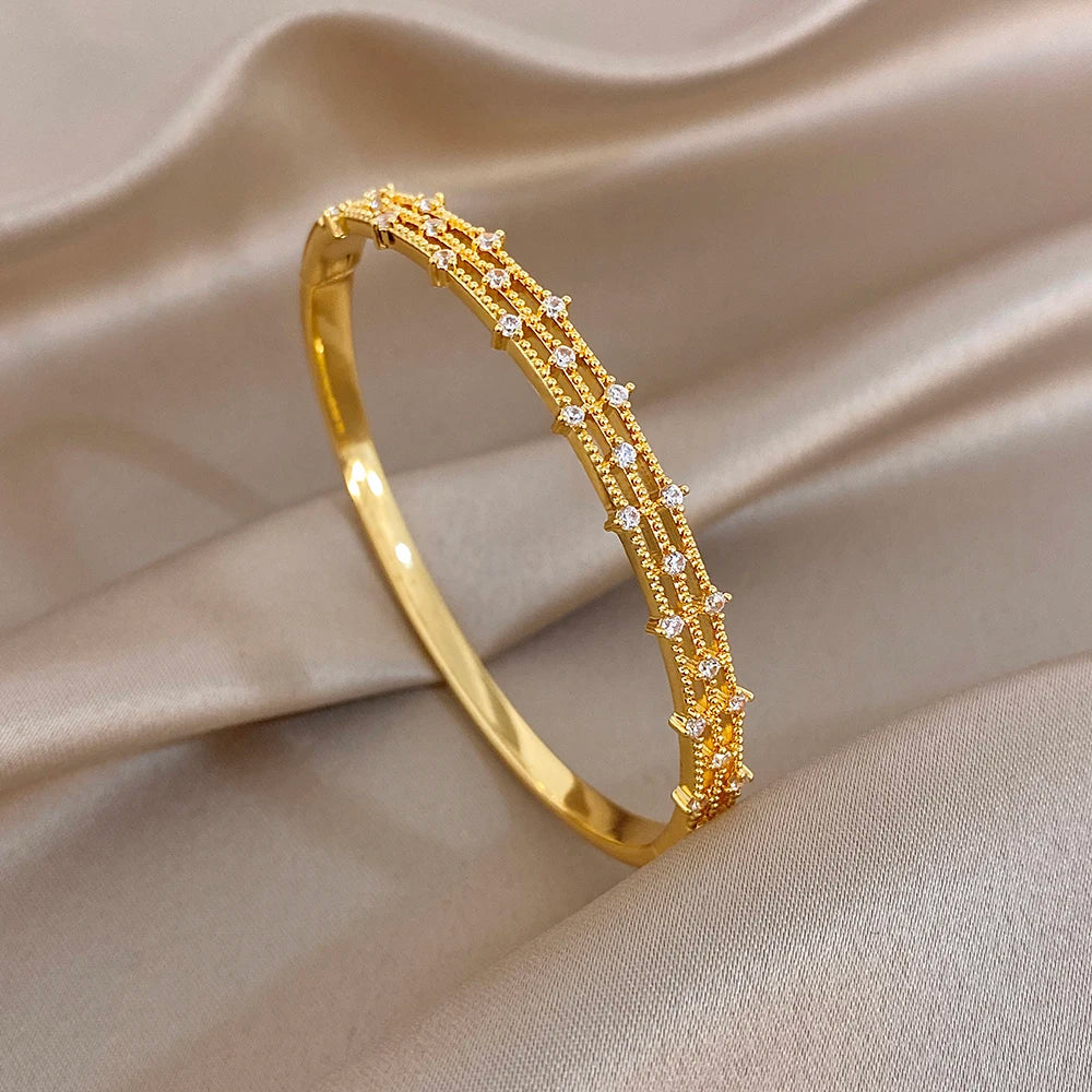 Elegant Geometric Winding Hollow Copper Bangle for Women Shiny Gold Plated Waterproof Spring Bracelet Lady Jewelry Gift